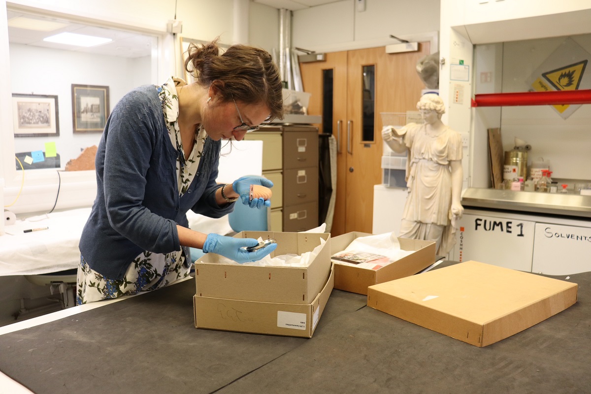 Miranda the project officer with faith objects in a laboratory