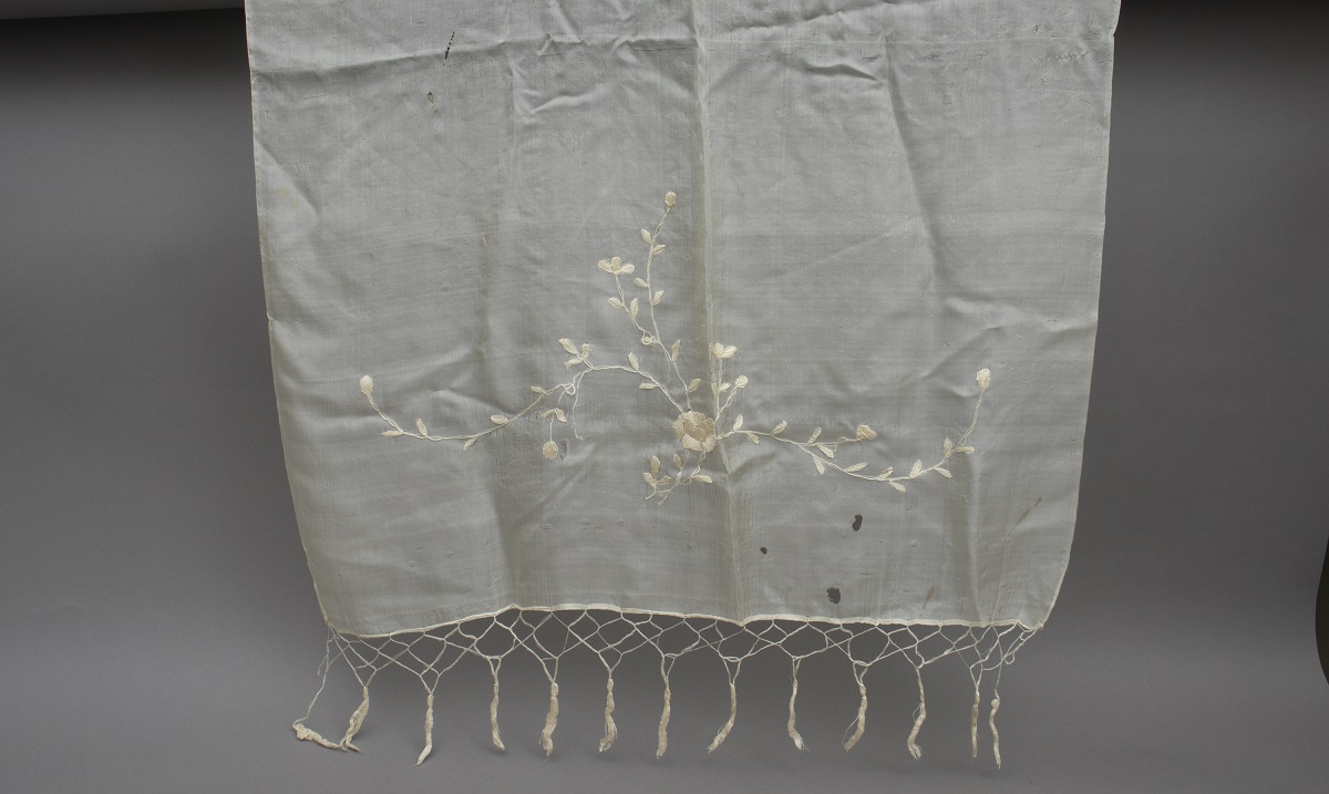 Detail of silk scarf with floral embroidery