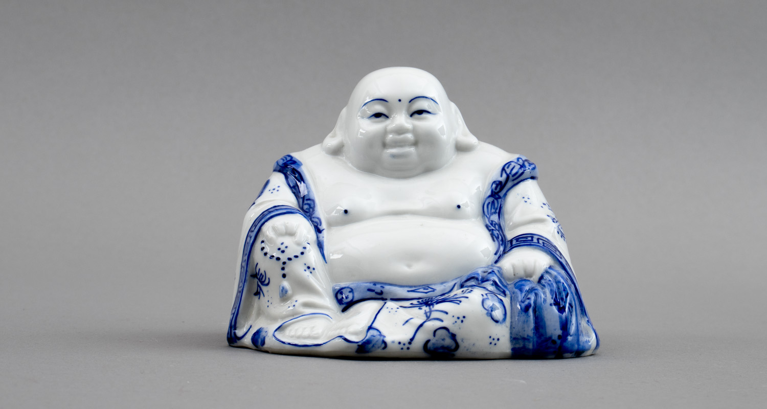 Blue and white ceramic figure of Buddha