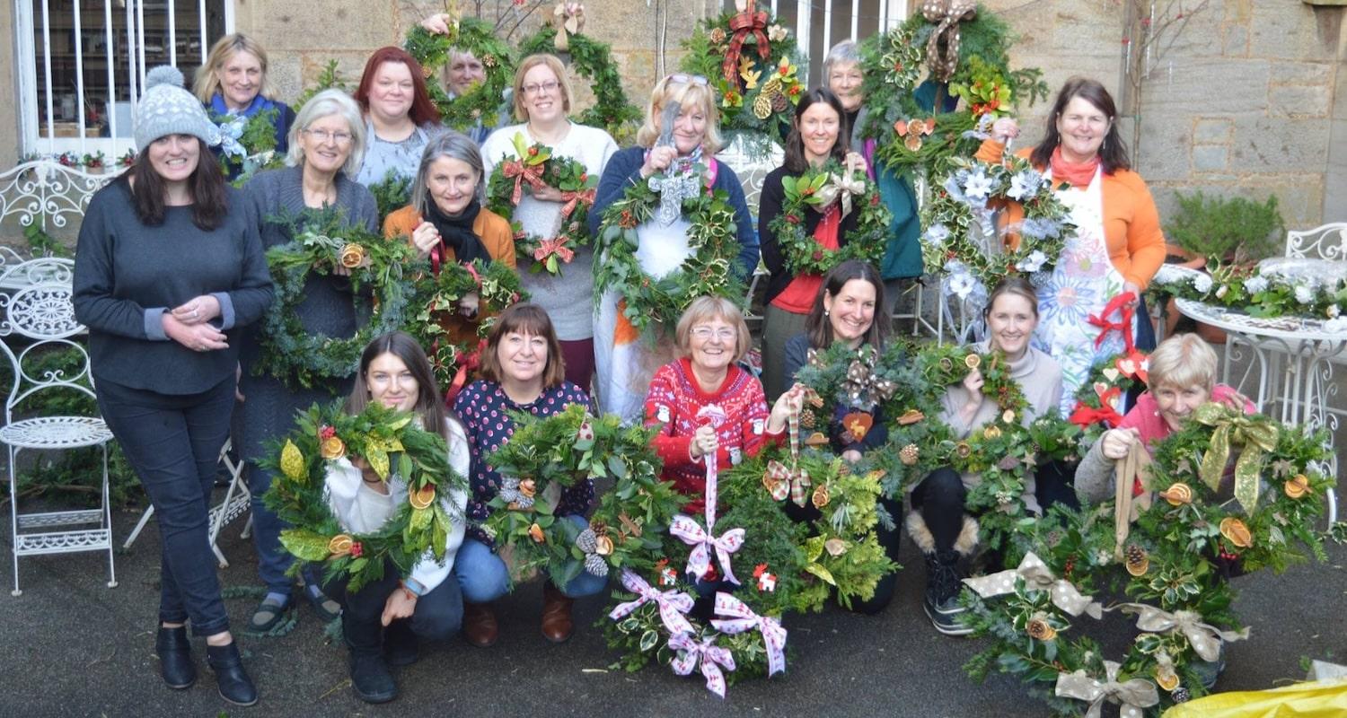 Course participants outside Lauriston Castle displaying the wreaths they have made