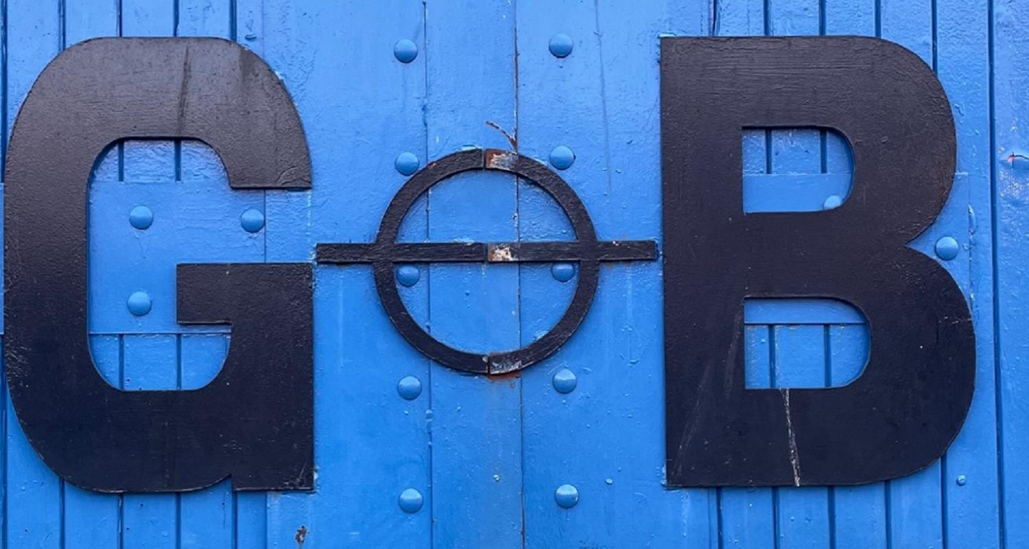 Iron lettering on the blue wooden door of George Brown & Sons