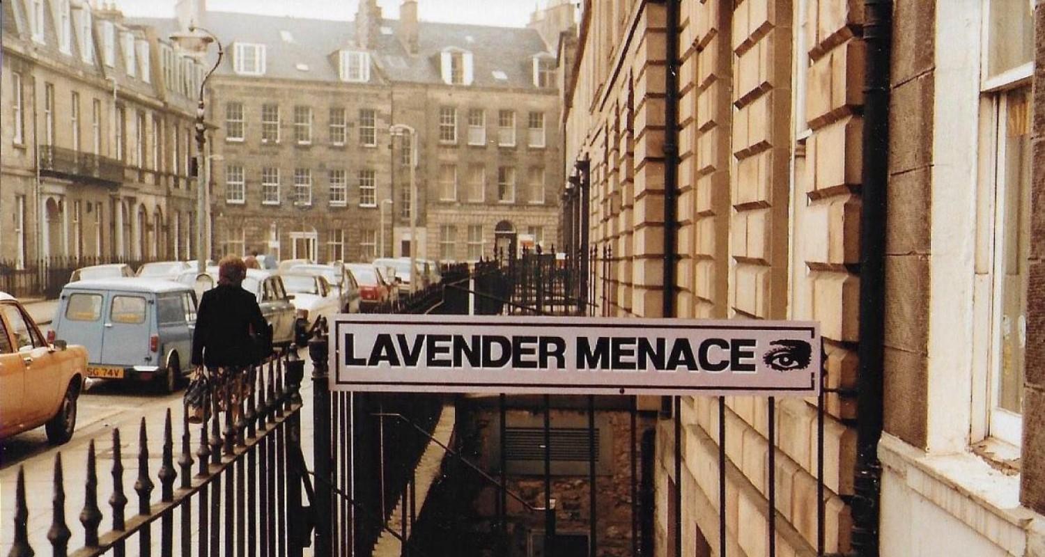 The Lavender Menace sign across the railings at the top of the stairs in Forth Street