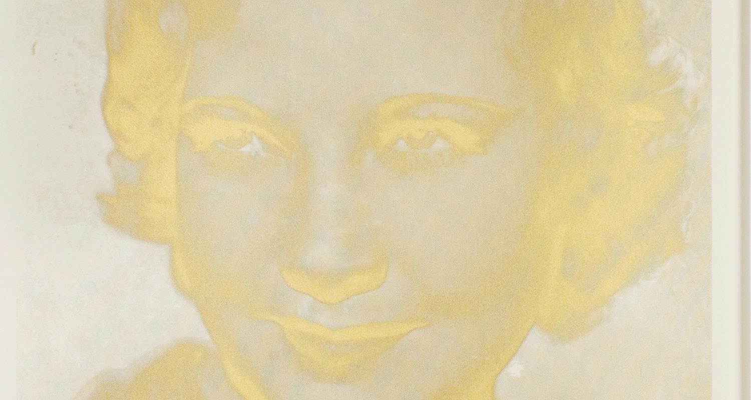 A screen print in golden yellows of a woman facing the viewer