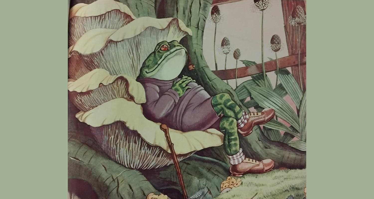 A drawing of a toad, in a purple jumper and shorts, wearing brogues, reclining on a leaf