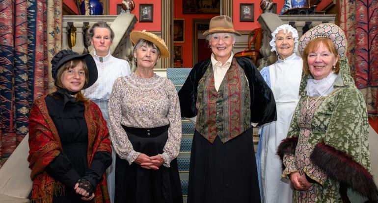 Edinburgh Living History Performers in Edwardian garb in front of the staircase inside Lauriston