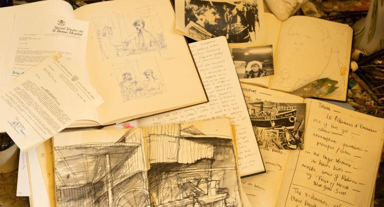 A pile of John Bellany's sketbooks with text and pen and ink drawings