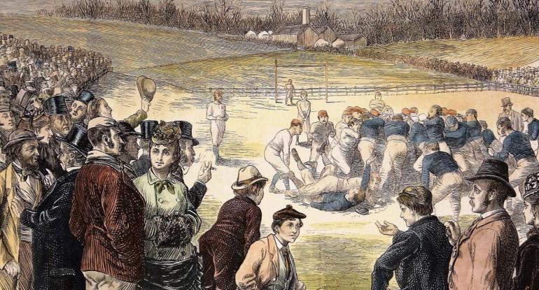 A painting of the action from a rugby match in 1871. A scrum of players is in the centre and crawds stand behind a fence nearby